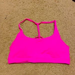 Neon pink Feed Me Fight Me sports bra